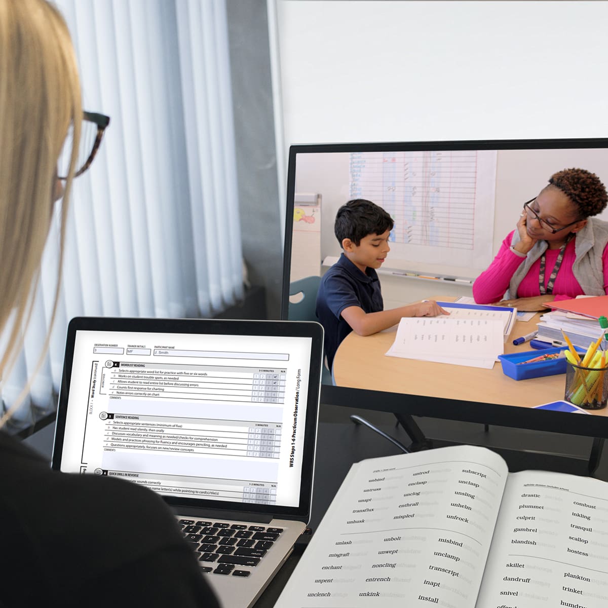 Fun35 Woman with blonde hair watching a live training session of a woman with dark hair teaching a young student